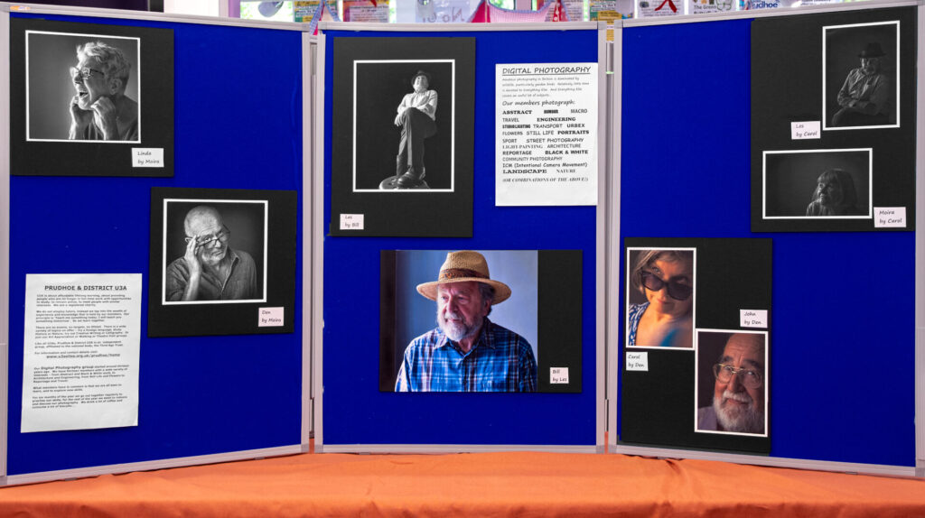 display board with various member's work on it
