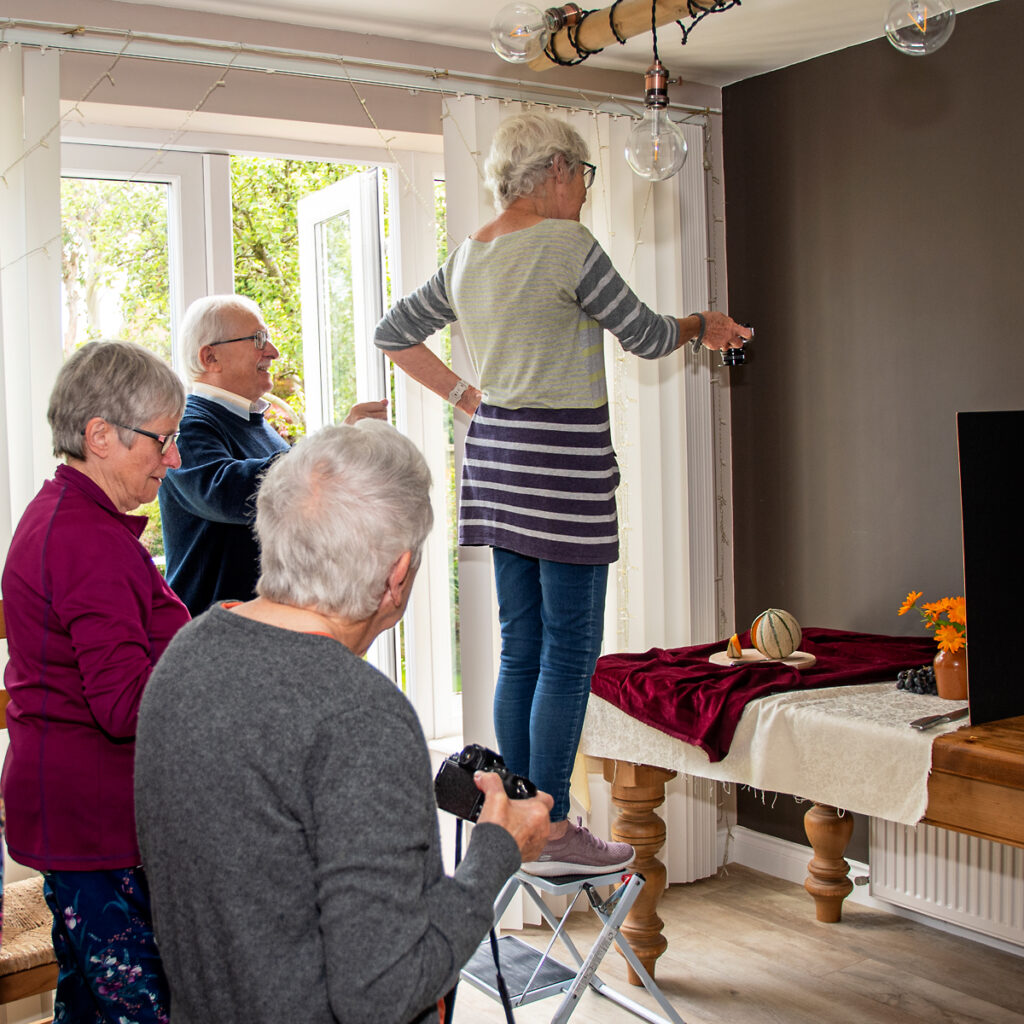 people looking at still life
